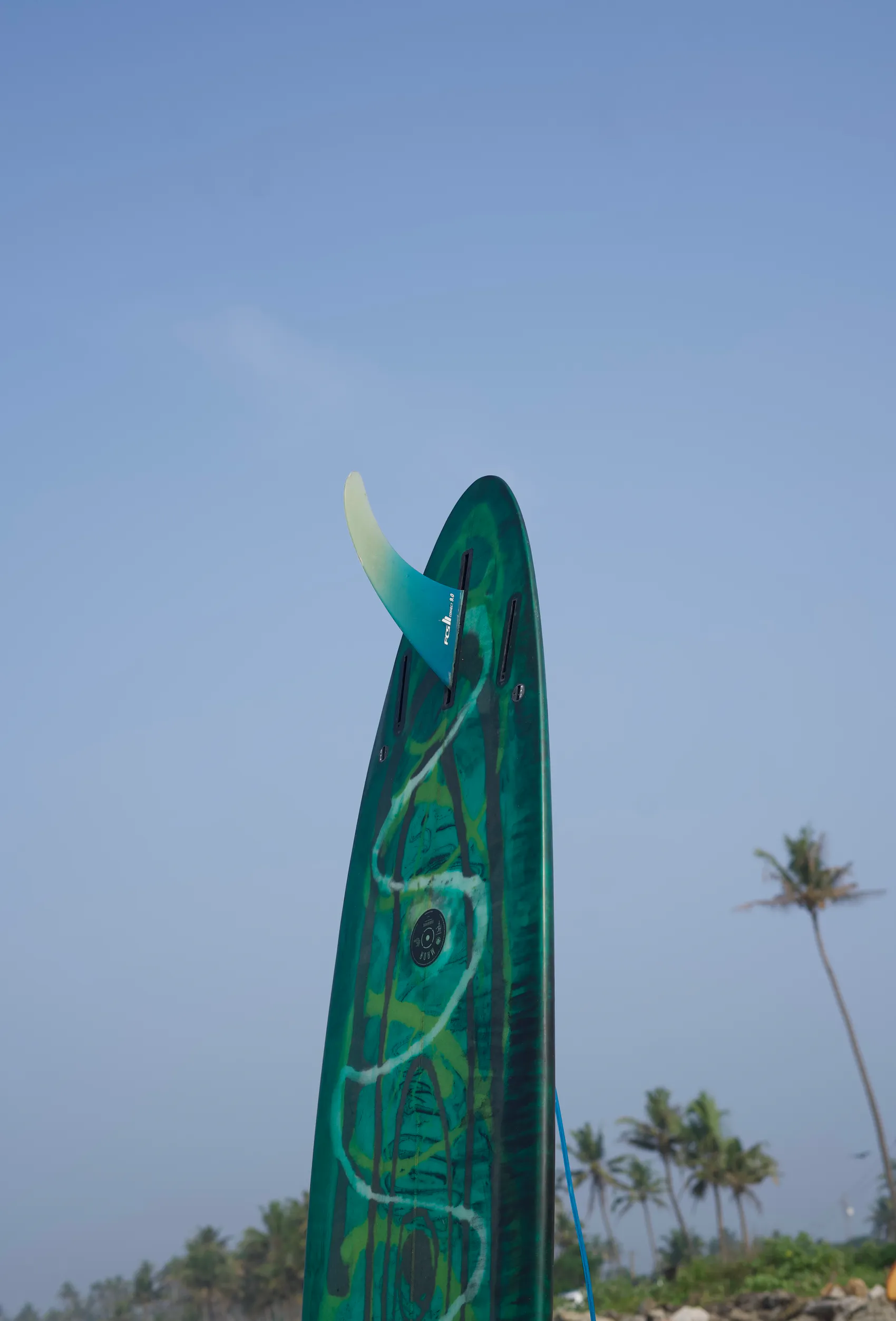 A Paddlecult surfer carrying a board