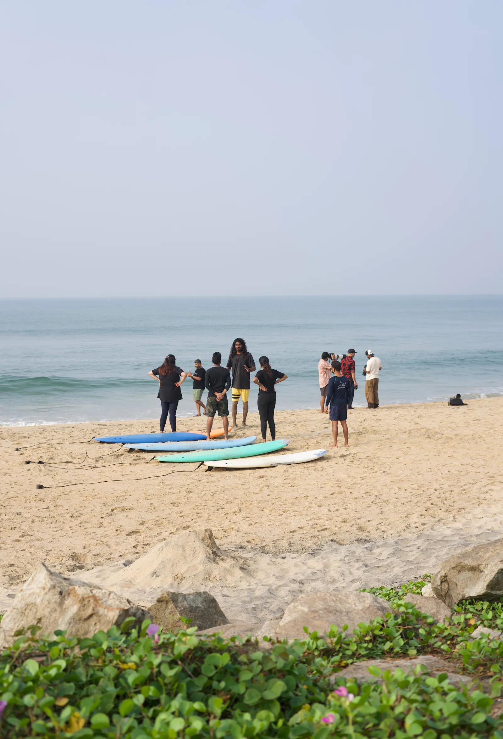Surfers together on the beach