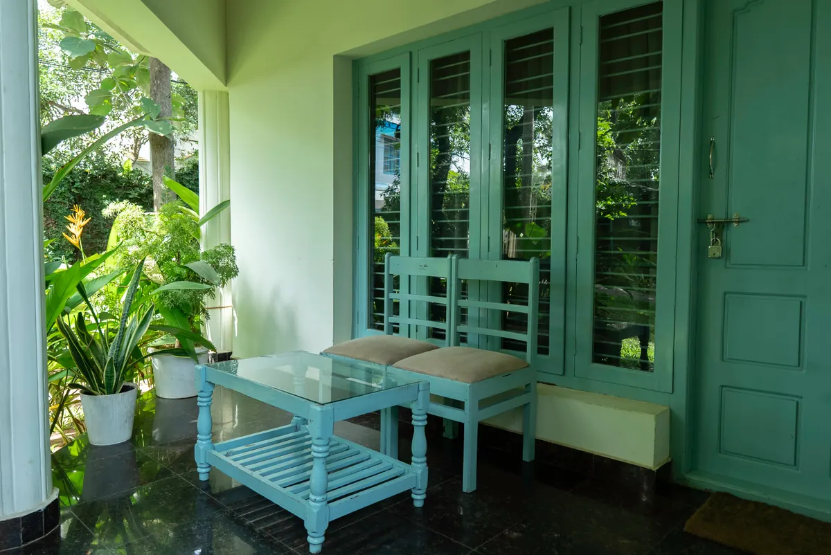 Shaded veranda seating outside the Paddlecult rooms