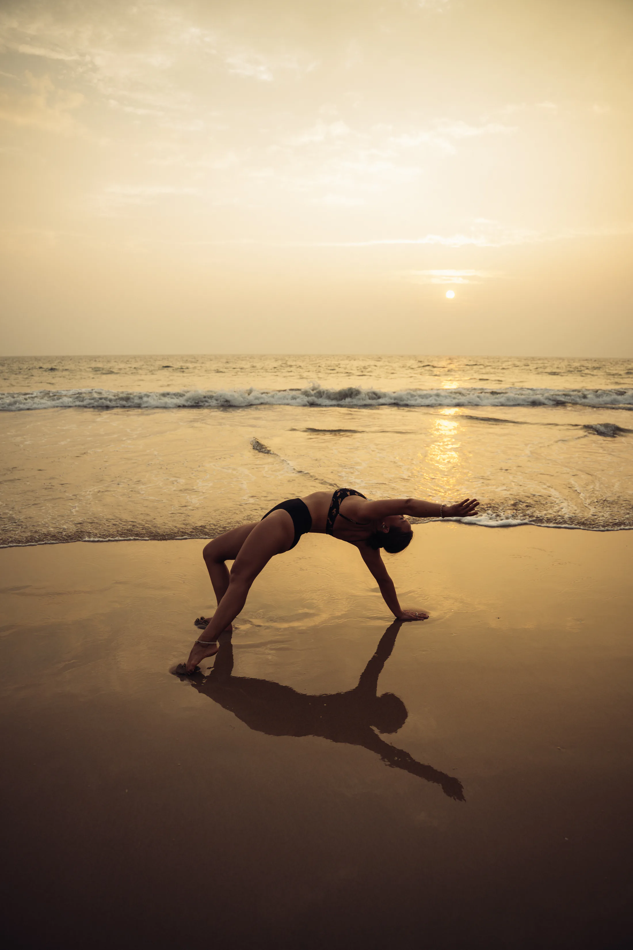 Movement practice beside the sea at sunset