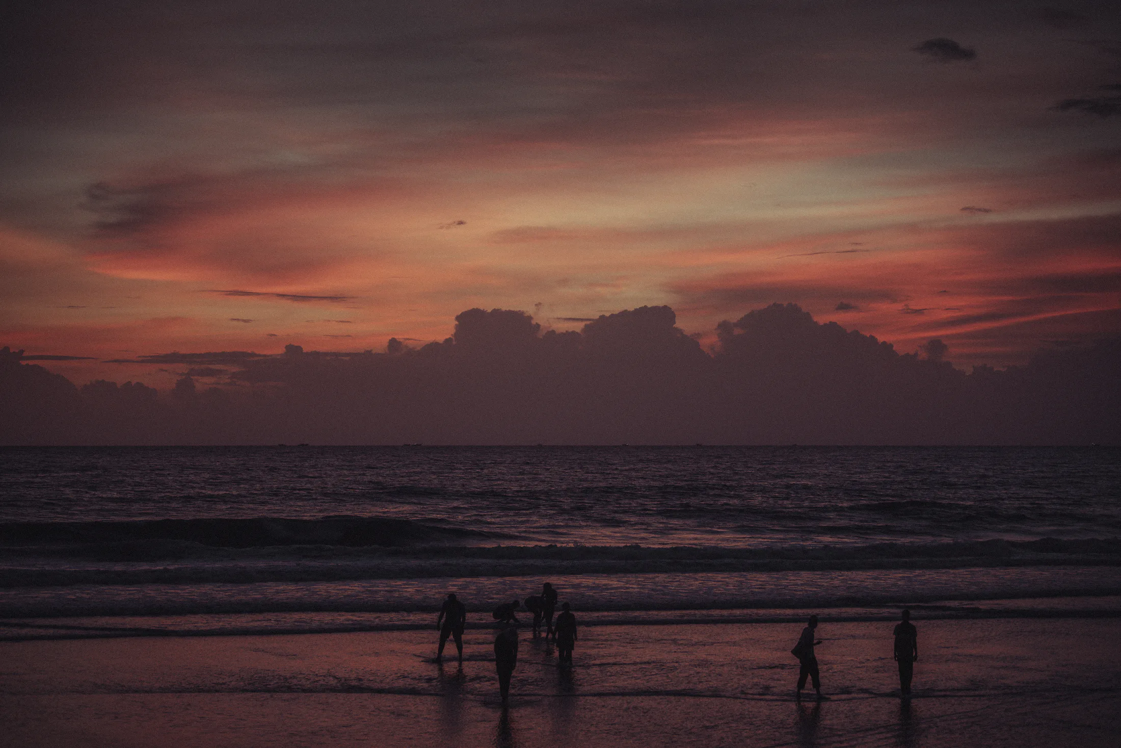 Silhouettes at sunset on Varkala beach