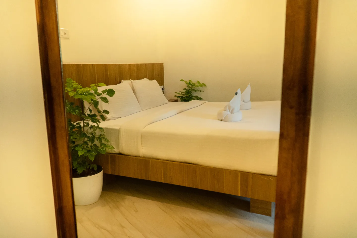 View through the Coastal Room doorway towards the bed