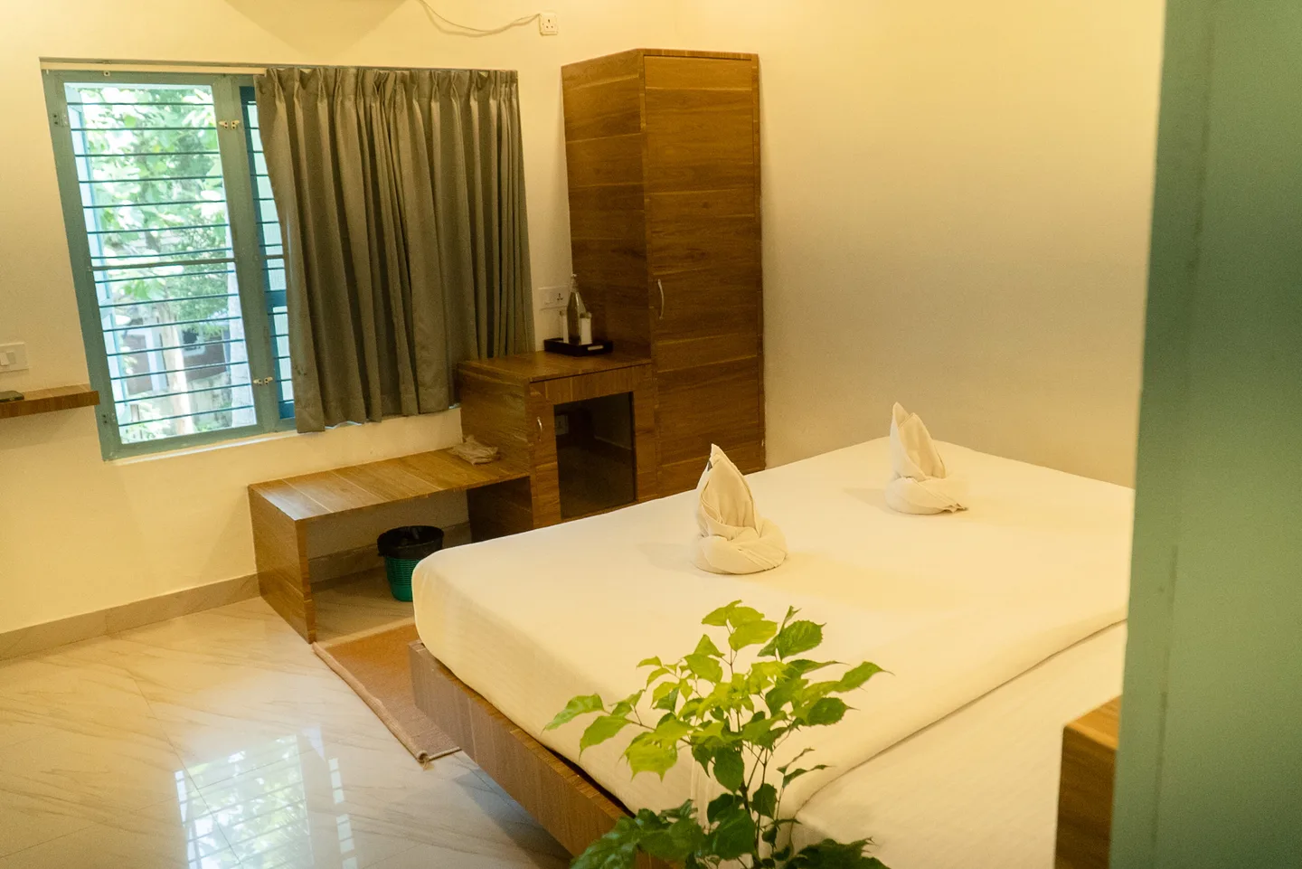 Coastal Room window, wardrobe and built-in desk beside the bed