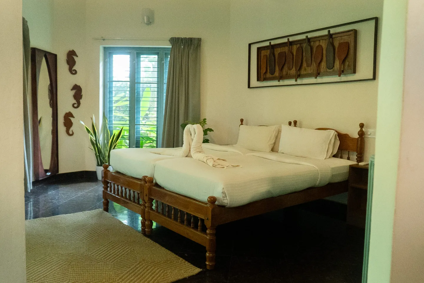 Tropical Cottage bedroom with a king-size bed and garden-facing window